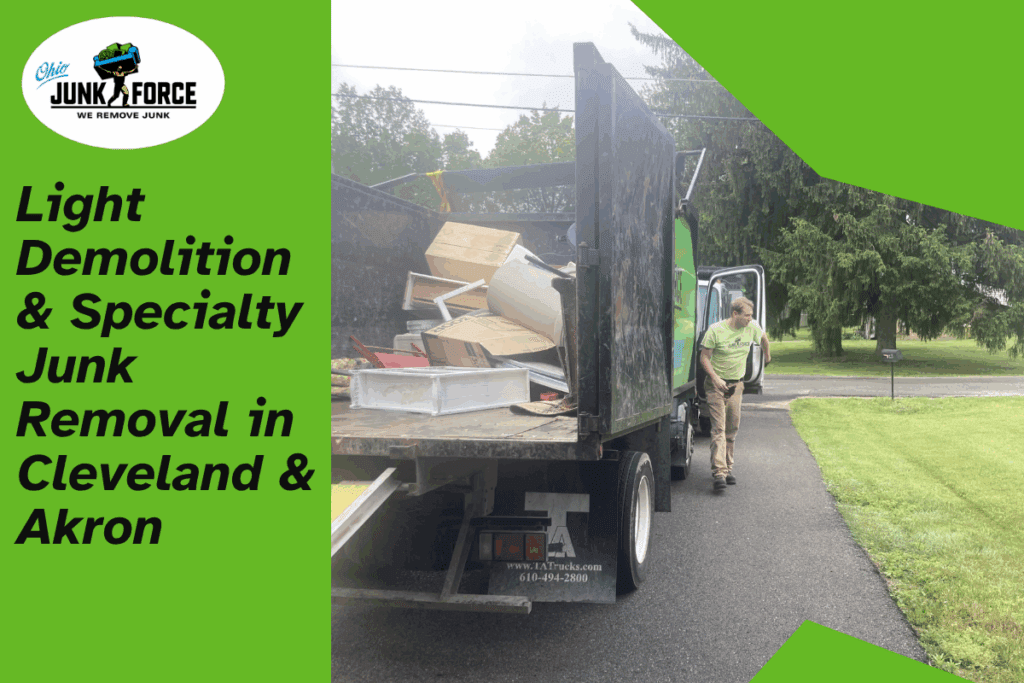 Ohio Junk Force truck loaded with debris in a residential driveway with a crew member walking beside it for light demolition and specialty junk removal in Cleveland and Akron