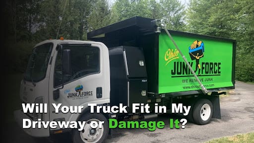 Compact Ohio Junk Force green dump truck parked on driveway, branded "We Haul Ohio"; white overlay text asks "Will Your Truck Fit in My Driveway or Damage It?" reassuring easy access for junk removal.